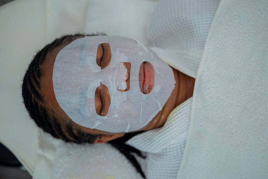 Client receiving a relaxing facial treatment at a spa
