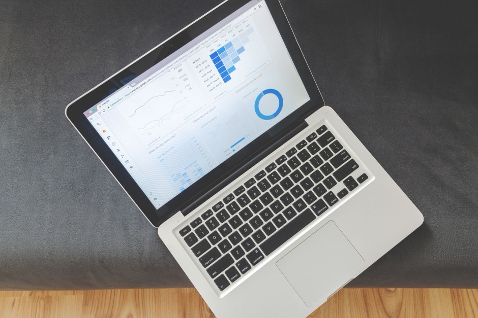 Laptop screen showing website traffic and analytics charts