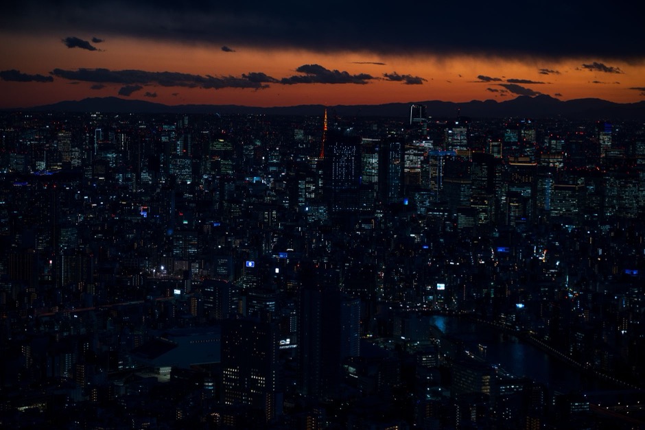 Tokyo's skyline at twilight with Tokyo Tower illuminated