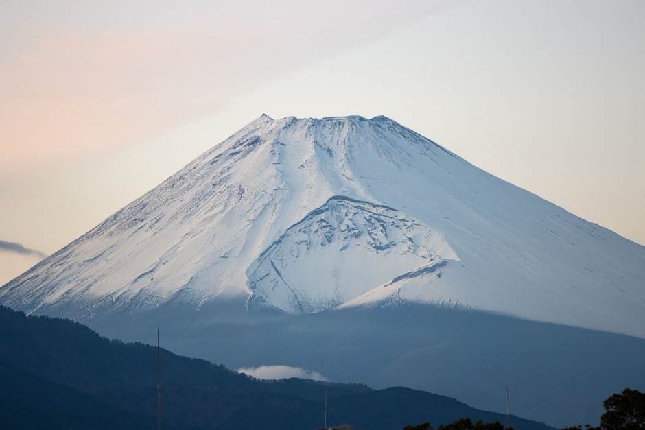 Snow-capped Mount Fuji under a calm sky