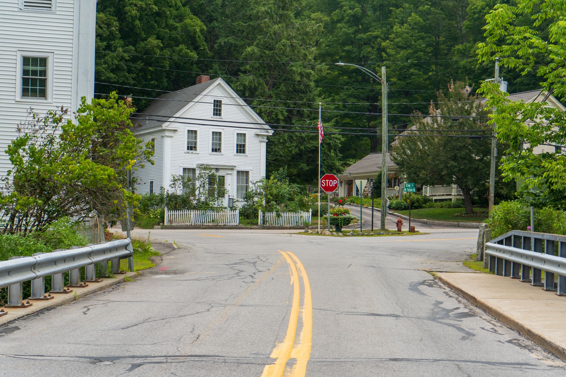 Classic white New England houses on a quiet residential street