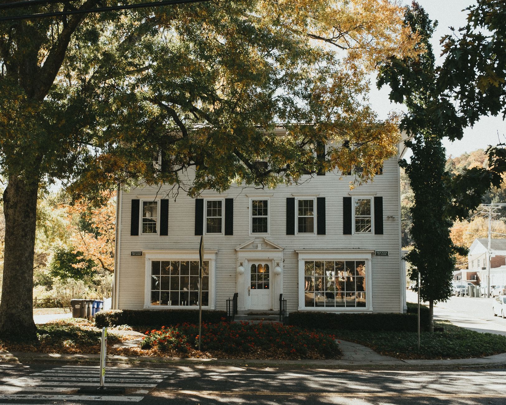 Colonial-style building in Connecticut surrounded by autumn foliage