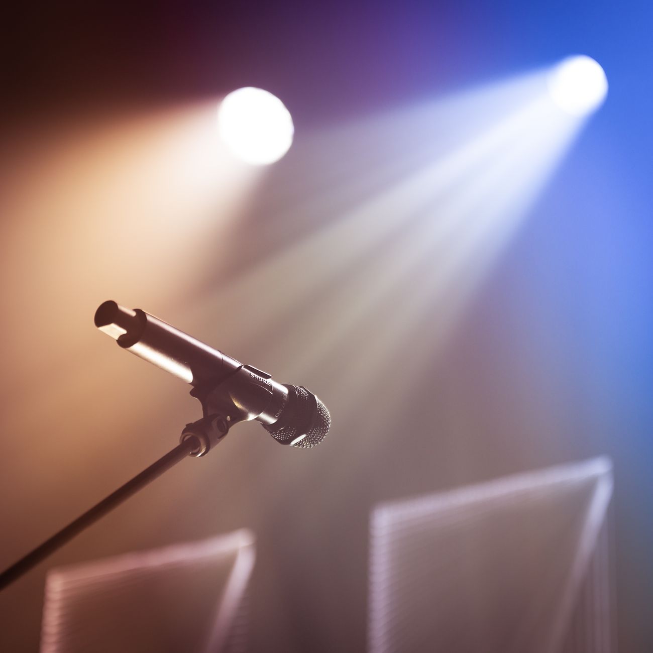 Microphone on a stand, representing press and media coverage