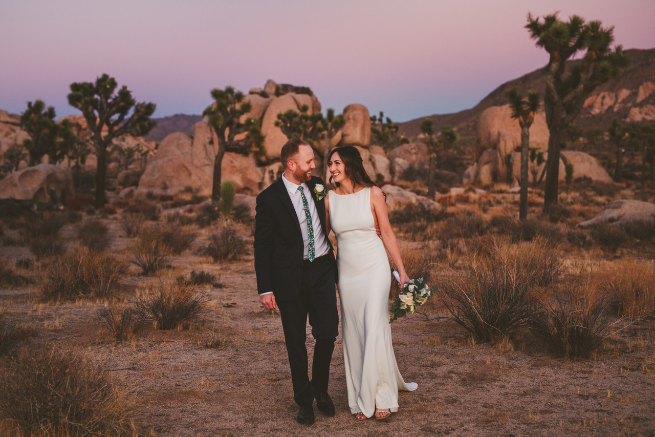 Ryan Horban Photography wedding couple embracing among Joshua trees at sunset