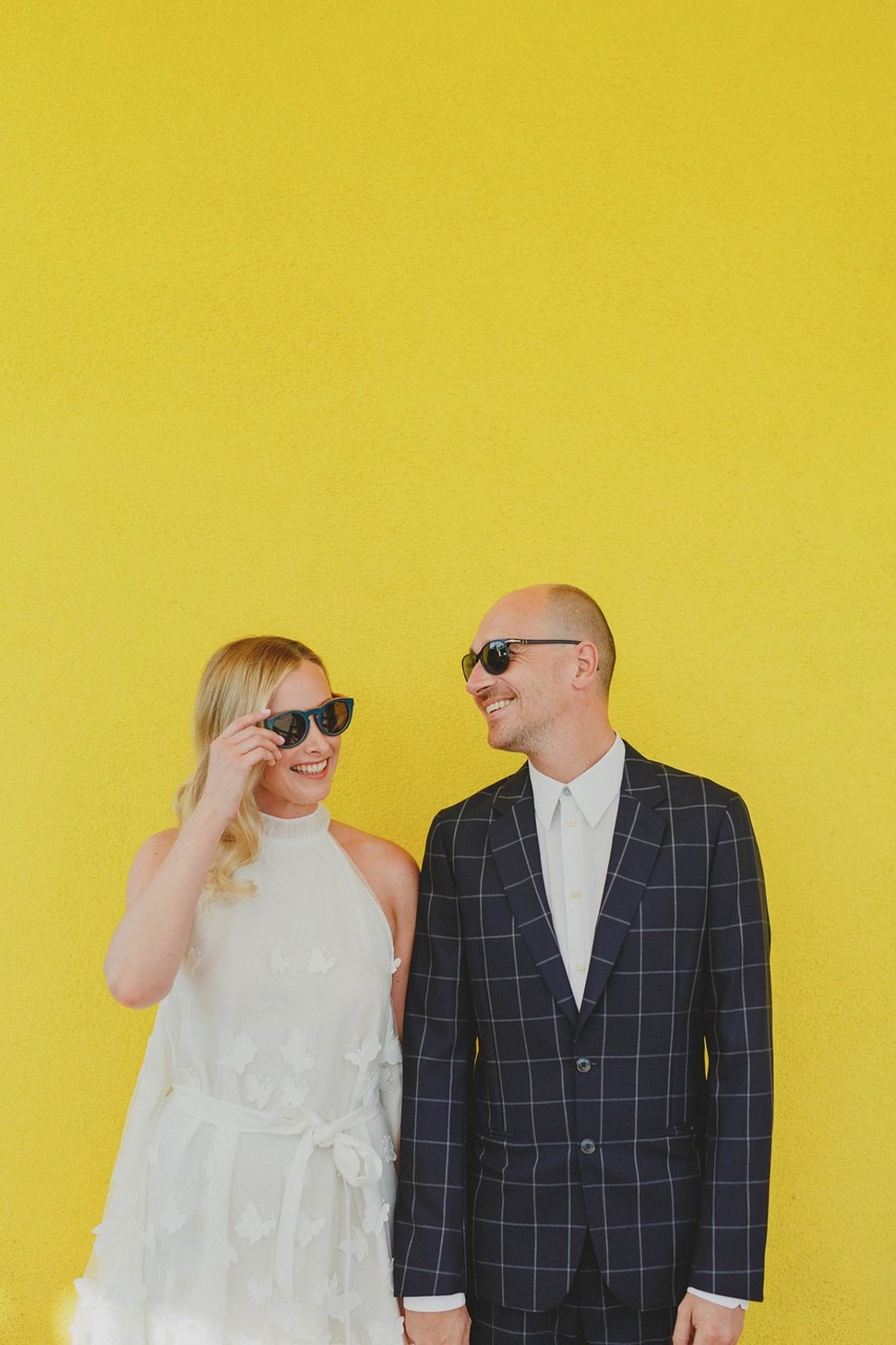 Ryan Horban Photography wedding couple in sunglasses against a bright yellow wall