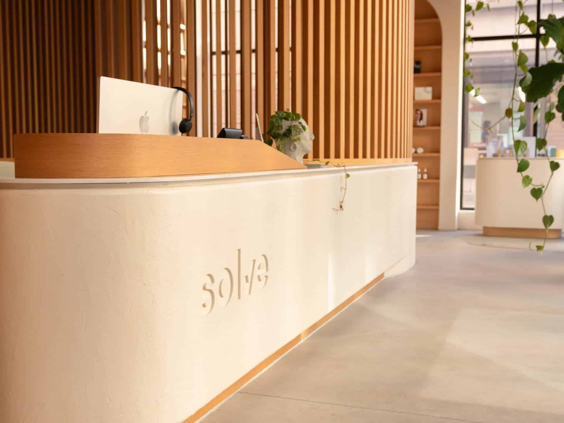 Reception desk carrying the Solve logo at the Solve Clinics River North location in Chicago